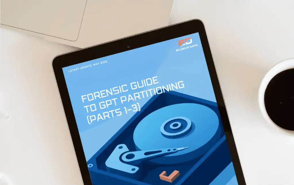 Tablet com a capa do guia forense gratuito sobre o particionamento de discos GPT e uma chávena de café